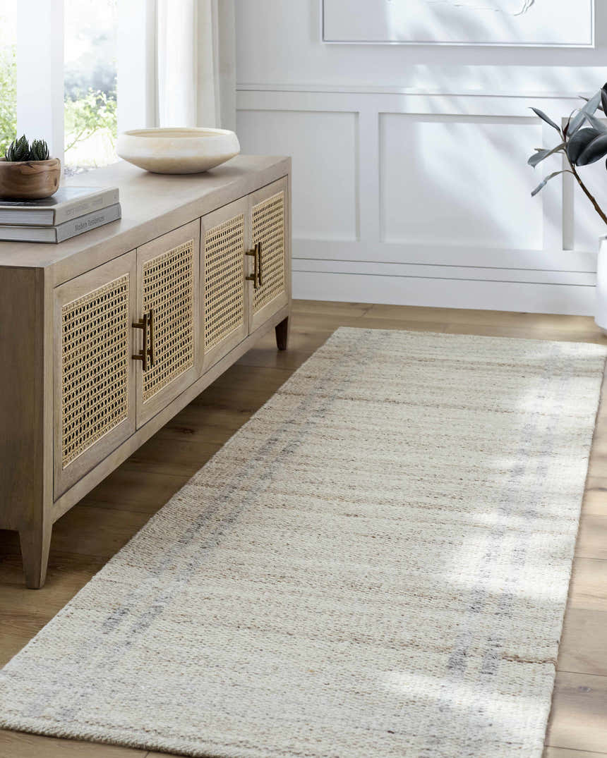 Entryway with a woven Nimue Tan Area Rug runner, light wood floors, and a console table. Roomscene-Rectangle