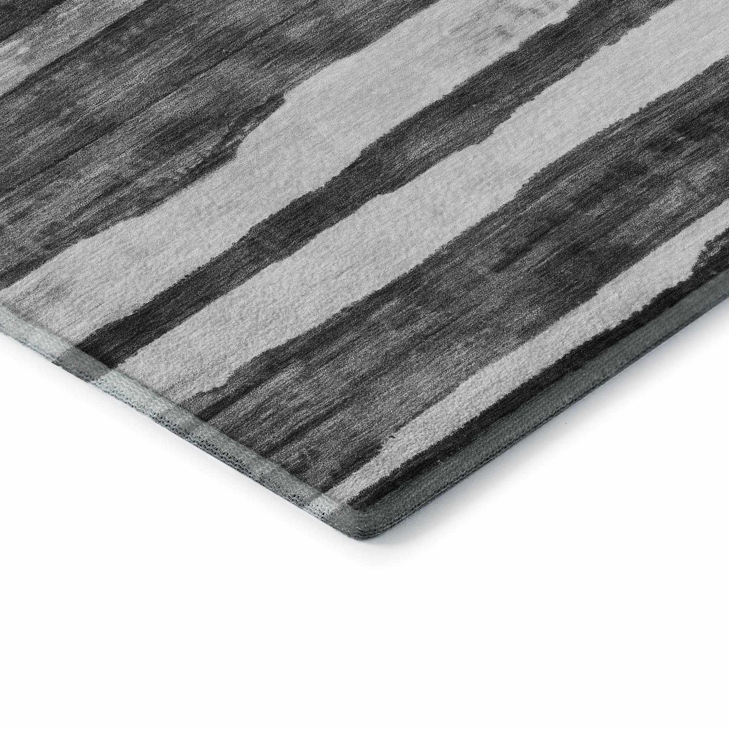 Close-up of Dalyn Neo NO16 Charcoal Washable Area Rug showing the charcoal and silver gray striped pattern and texture.