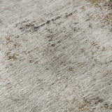 Close-up of Dalyn Neo NO4 Putty Washable Area Rug. Beige rug with caramel, chestnut, and taupe abstract pattern.