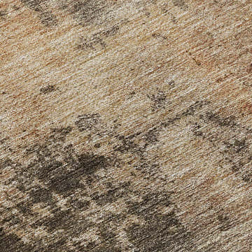 Close-up of Dalyn Nouveau NV24 Khaki Washable Area Rug. Beige, caramel, and tan tones with a subtle textured pattern.