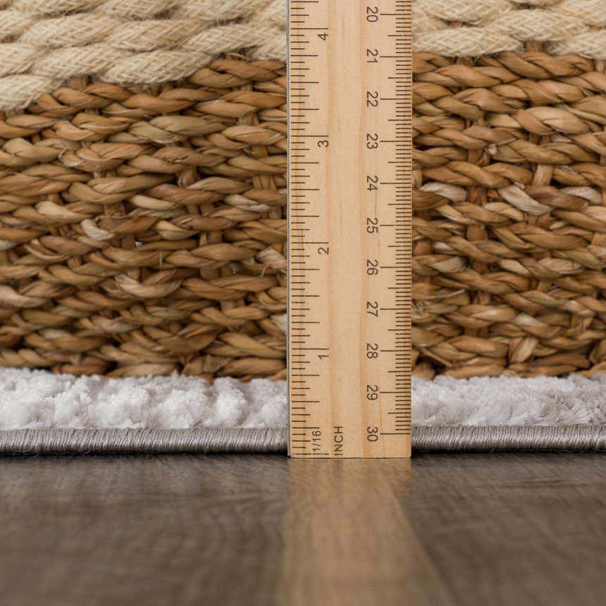 Close-up of Arissa Broken-Striped Rug texture and pile height with ruler. Colors are black, gray, and white. Pile