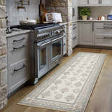 Kitchen scene with the Aquene Ivory Washable Area Rug runner, blush and sage floral pattern, wood floors, and gray cabinets. Roomscene-Runner