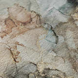 Close-up of the Dalyn Luxury Odyssey OY12 Tan Washable Area Rug. Beige, caramel, and light blue abstract pattern.