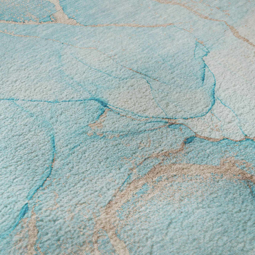 Close-up of the Dalyn Luxury Odyssey OY7 Teal Washable Area Rug, featuring beige and sky blue marbled design.