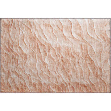 Dalyn Pacifica PA1 Coral Washable Area Rug. Close-up shows a wavy, sand-like pattern in coral, rust, and chestnut hues.