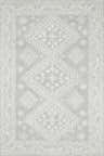 Close-up of the Paloma Area Rug. Hand-tufted wool rug in cream, light beige, and gray with a geometric diamond pattern. Design-Rectangle