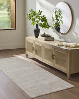 Entryway with wood floors, console table, and a cream Axelia Charcoal Area Rug runner. Roomscene-Runner