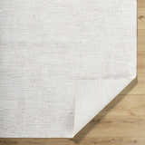 Close-up of the Axelia Charcoal Area Rug showing its cream and charcoal textured Southwestern-style design. Fold