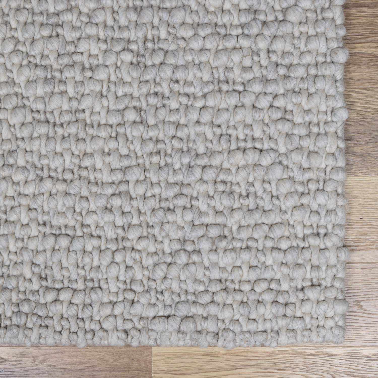 Penmaen Solid Cream Hand-Woven Wool Rug