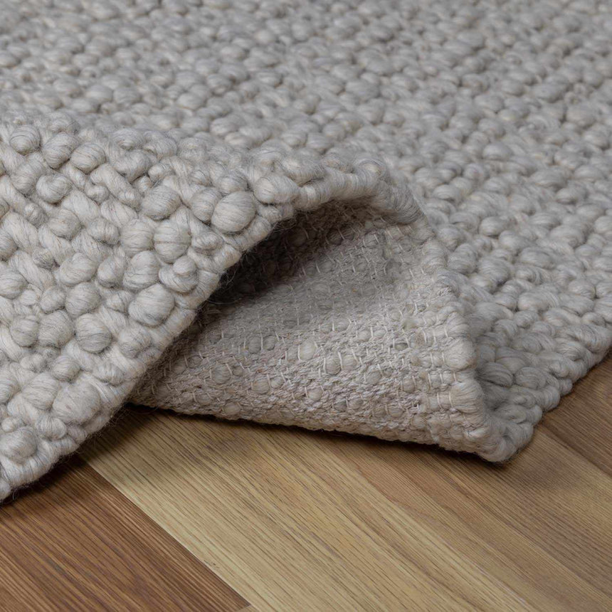 Penmaen Solid Cream Hand-Woven Wool Rug