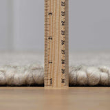 Penmaen Solid Cream Hand-Woven Wool Rug