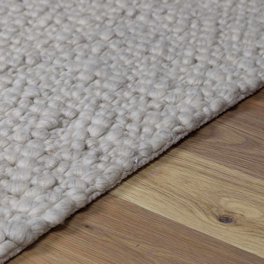 Penmaen Solid Cream Hand-Woven Wool Rug