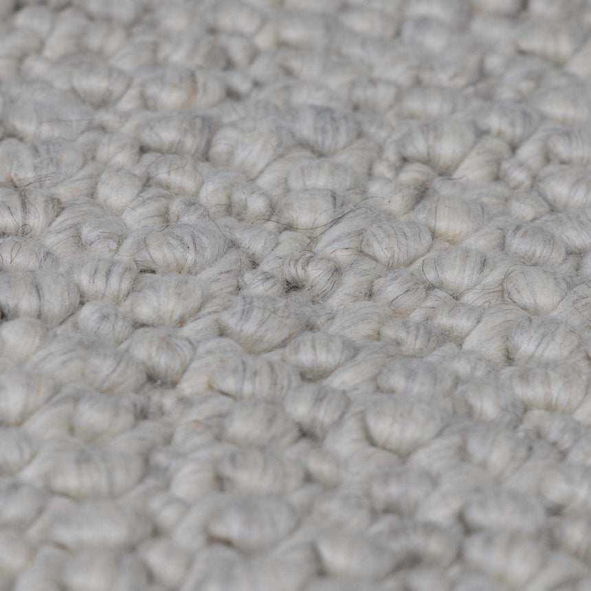 Penmaen Solid Cream Hand-Woven Wool Rug
