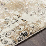 Close up of the Pewamo Area Rug showing beige, tan, and charcoal abstract pattern. Texture