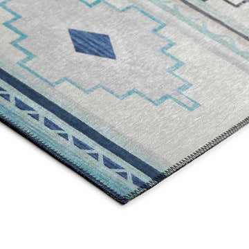 Close-up of Dalyn Phoenix PH1 Pacifica rug. Southwestern design in beige, denim, and soft teal. Machine-made texture.