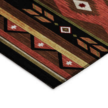Close-up of the Southwestern style Dalyn Phoenix PH3 Chocolate Washable Area Rug with beige, brown, paprika, and green geometric patterns.