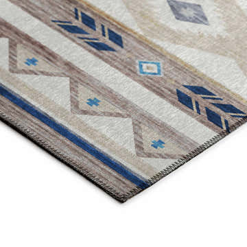 Close-up of Dalyn Phoenix PH3 Ivory Washable Area Rug. Southwestern style with beige, blue, and taupe geometric pattern.