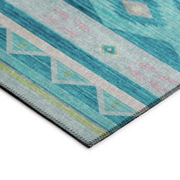 Close-up of Dalyn Phoenix PH3 Teal Washable Area Rug. Southwestern design with teal, beige, and lime green colors.