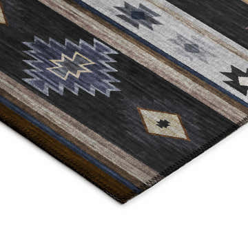 Close-up of the Dalyn Phoenix PH4 Black Washable Area Rug. Southwestern style with beige, black, ivory, and taupe geometric patterns.