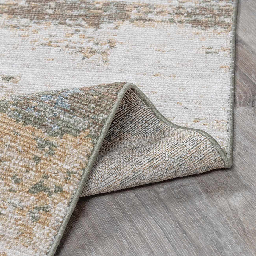 Close-up of the Galey Alix x Livabliss Abstract Modern Marble Cream Myrtle Avenue III Area Rug showing texture and backing. Fold