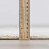 Close-up of Galey Alix x Livabliss Abstract Modern Marble Cream Myrtle Avenue III Area Rug thickness with ruler. Pile