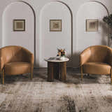 Living room scene with camel chairs and Galey Alix x Livabliss Myrtle Avenue III area rug in cream, camel, and brown tones. Roomscene-Rectangle