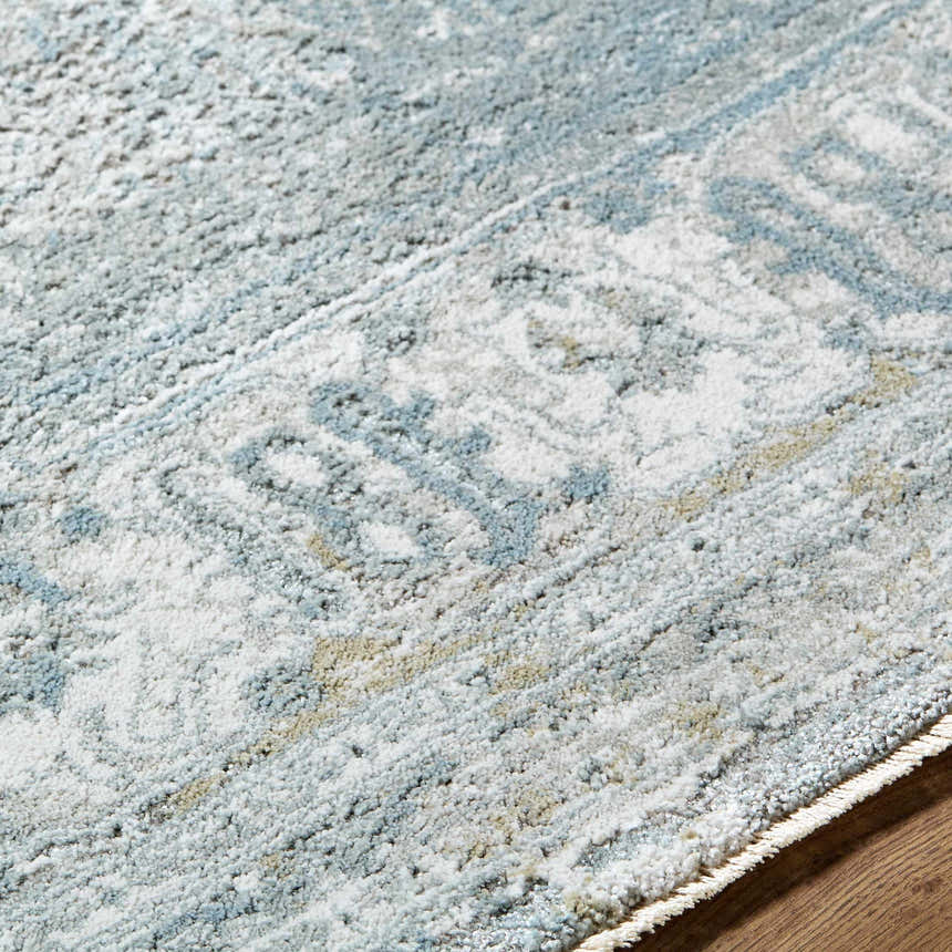 Close-up of the Pryce Blue Gray Thick Luxe Boutique Rug showing its traditional pattern and soft texture. Texture