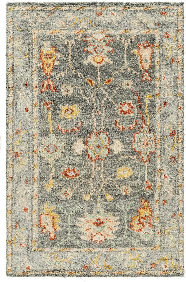 Close-up of the Prosperidad Handmade Wool Rug, featuring a traditional floral pattern in brick red, mustard, and light gray. Design-Rectangle-69