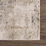 Close up of the Pewamo Area Rug showing its beige, tan, charcoal, and black contemporary design. Swatch