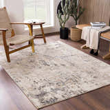 Living room scene with a neutral Pewamo Area Rug, wood furniture, and natural light creating a calm, contemporary mood. Roomscene-Rectangle