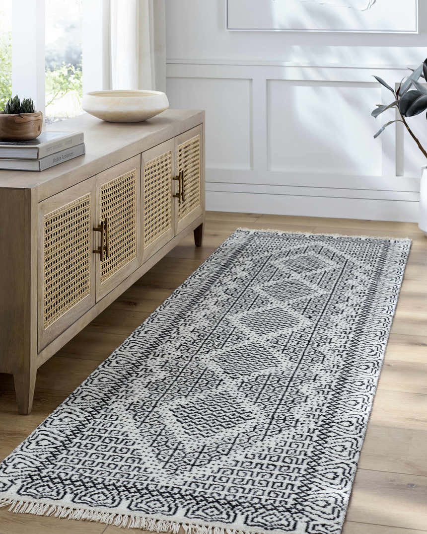Entryway with Bone Rach Area Rug runner, dark gray pattern, wood console table, and light wood floors. Roomscene-Runner