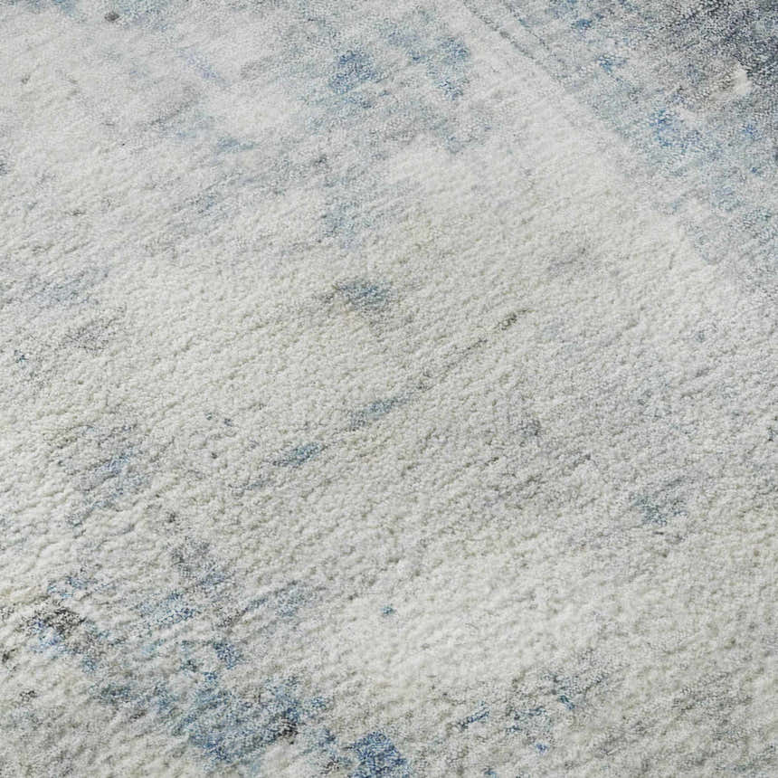 Close-up of the Dalyn Luxury Ravenna RN1 Blue Washable Area Rug, showing its soft texture and blue and gray wash pattern.