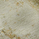 Close-up of the Dalyn Luxury Ravenna RN1 Olive Washable Area Rug. Beige, caramel, gold, and olive tones.