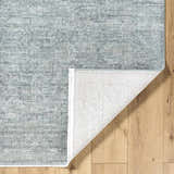 Close-up of the Livabliss x Galey Alix Maria Elena II rug, showing its cream, black, and gray vintage medallion pattern and texture. Fold