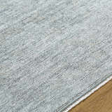 Close-up of the Livabliss x Galey Alix Maria Elena II rug, showing its texture and cream, gray, and black vintage medallion pattern. Texture