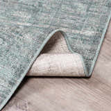 Close-up of Livabliss x Galey Alix Maria Elena II rug showing its vintage medallion pattern and black, cream and gray colors. Fold