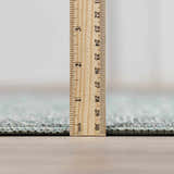Close-up of the Livabliss x Galey Alix Maria Elena II rug pile height, showing its texture with a ruler for scale. Pile