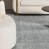 Close-up of Livabliss x Galey Alix Maria Elena II rug in gray. Cream sofa and ottoman add a cozy feel to the room. Roomscene-Rectangle