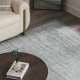 Living room scene with a cream sofa and Livabliss x Galey Alix Maria Elena II Vintage Medallion Area Rug in black, cream, and gray. Roomscene-Rectangle
