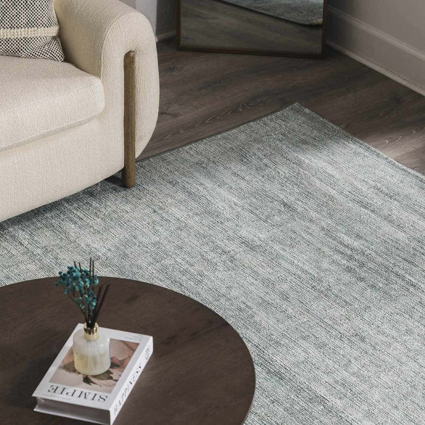 Living room scene with a cream sofa and Livabliss x Galey Alix Maria Elena II Vintage Medallion Area Rug in black, cream, and gray. Roomscene-Rectangle