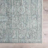 Close-up of the Livabliss x Galey Alix Maria Elena II rug. Vintage medallion pattern in black, cream, and gray polyester. Swatch