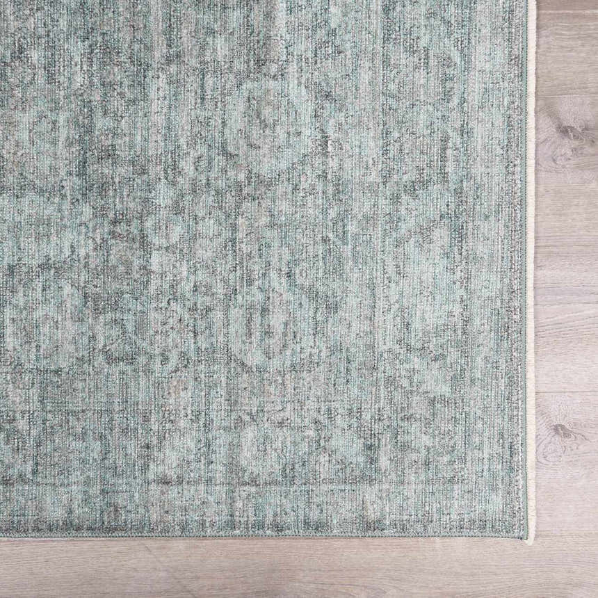 Close-up of the Livabliss x Galey Alix Maria Elena II rug. Vintage medallion pattern in black, cream, and gray polyester. Swatch