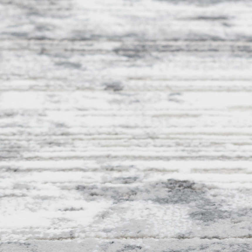 Close-up of the Dalyn Rhodes RR4 Gray Area Rug. Features a subtle horizontal stripe pattern in cream, silver gray, and taupe.