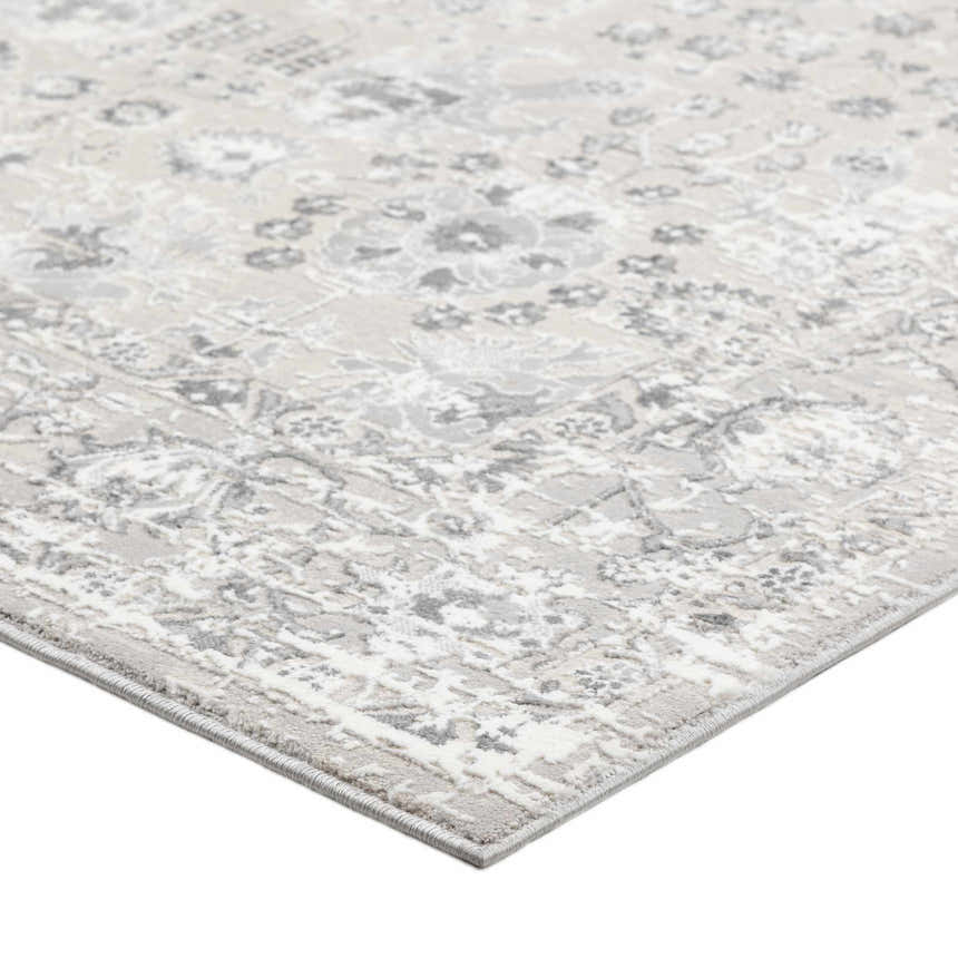 Close-up of the Dalyn Rhodes RR8 Silver Area Rug showing its floral pattern in cream, silver gray, and taupe.