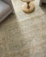 Close-up of Becki Owens x Livabliss Renaissance rug. Beige, denim, and coral traditional pattern with a farmhouse style. Styleshot