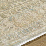 Close up of Becki Owens x Livabliss Renaissance BORI-2302 rug. Beige, denim, coral, and tan traditional wool rug. Texture