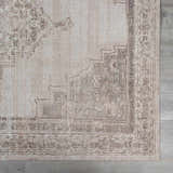 Close up of the beige and dark brown Luciana III Traditional Medallion Area Rug showing pattern and texture. Swatch