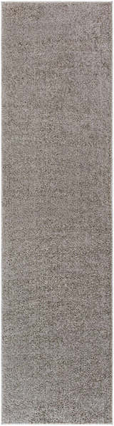 Close-up of the Judy Solid Dark Gray Washable Shag Rug, showing its soft, textured polyester pile and neutral gray color. Design-Runner-2710