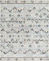 Close-up of the hand woven Denna Area Rug. Features a Southwestern pattern in black, blue, brown, and gray hues. Design-Rectangle-810