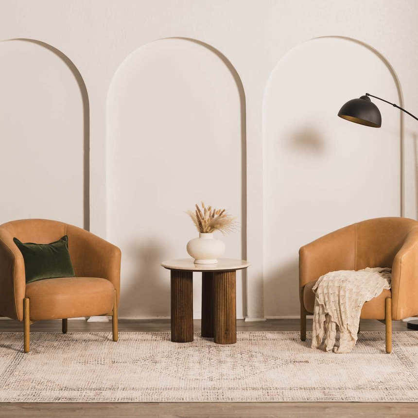Living room scene with two chairs on the Becki Owens x LIVABLISS Lila rug in off-white, black, and brown. Roomscene-Rectangle